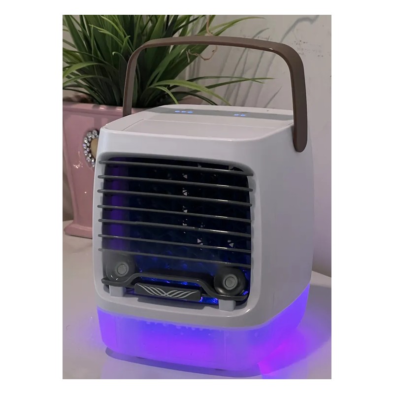 Cwell 2.0 Portable Air Cooler on a table with its night light on